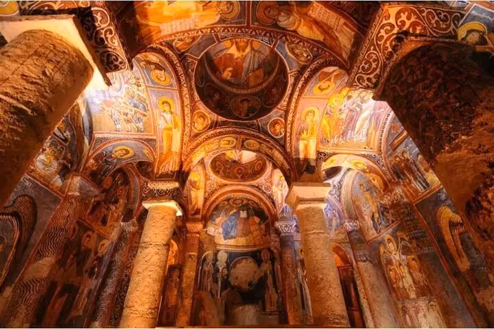 Frescoed interior of Göreme Open Air Museum rock-cut church, a highlight on the Cappadocia Red Tour