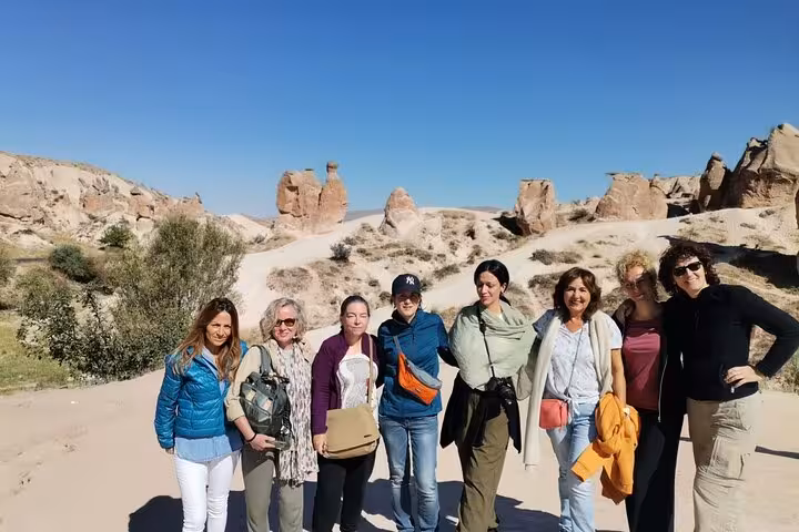 Group tour photo among Cappadocia fairy chimneys and valleys, Istanbul hotel pickup and flights included