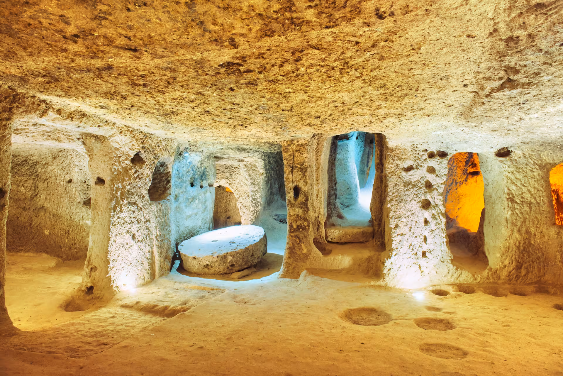 Illuminated Cappadocia underground city chamber with carved tunnels, featured on the 5-day Taste of Turkey itinerary