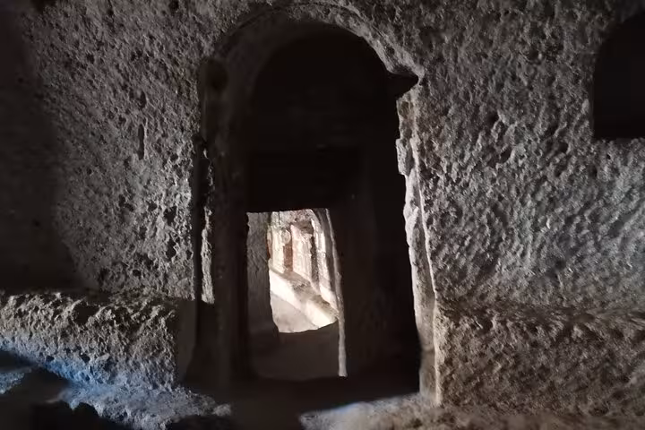 Narrow rock-cut passage inside a Cappadocia underground city, explored on an undiscovered private day tour