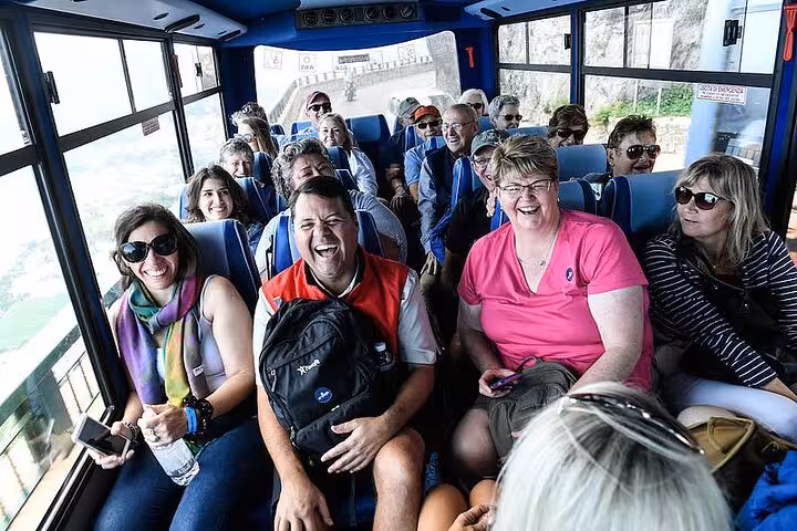 Group of tourists enjoying a scenic bus ride during the Capri & Anacapri hydrofoil tour from Amalfi and Maiori.