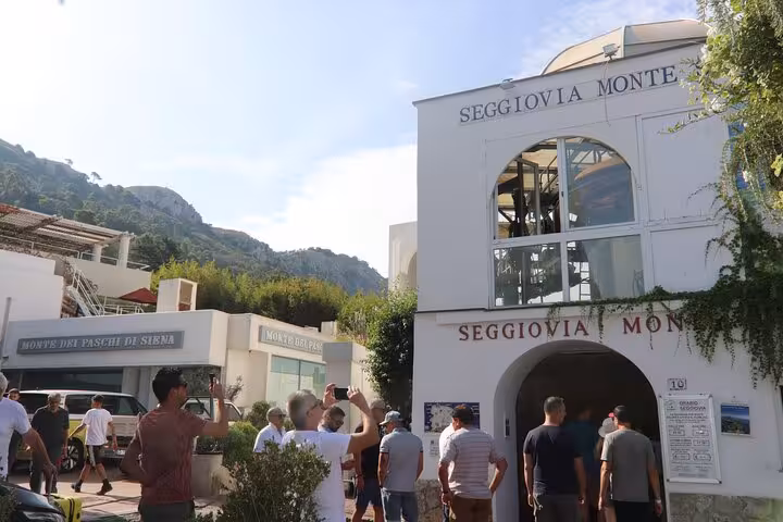 Visitors gather outside the Seggiovia Monte Solaro entrance, ready to explore the scenic views of Capri and Anacapri.