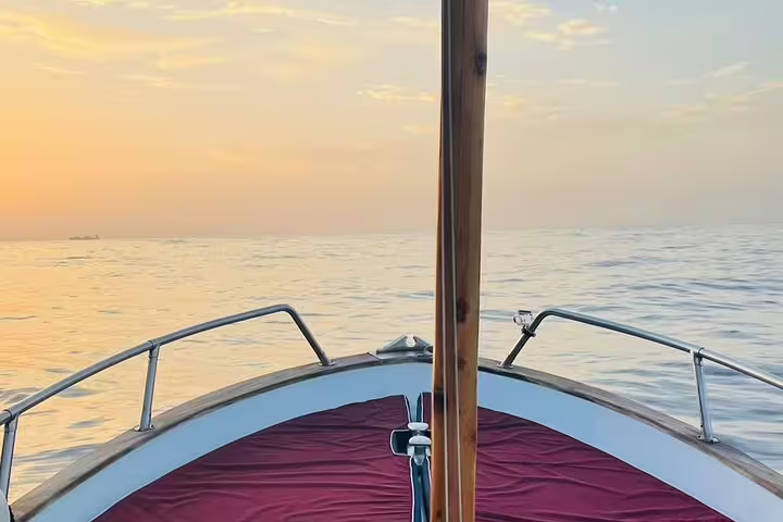 Bow view on a private boat tour at golden hour, calm sea day cruise with charm and freedom full-day escape