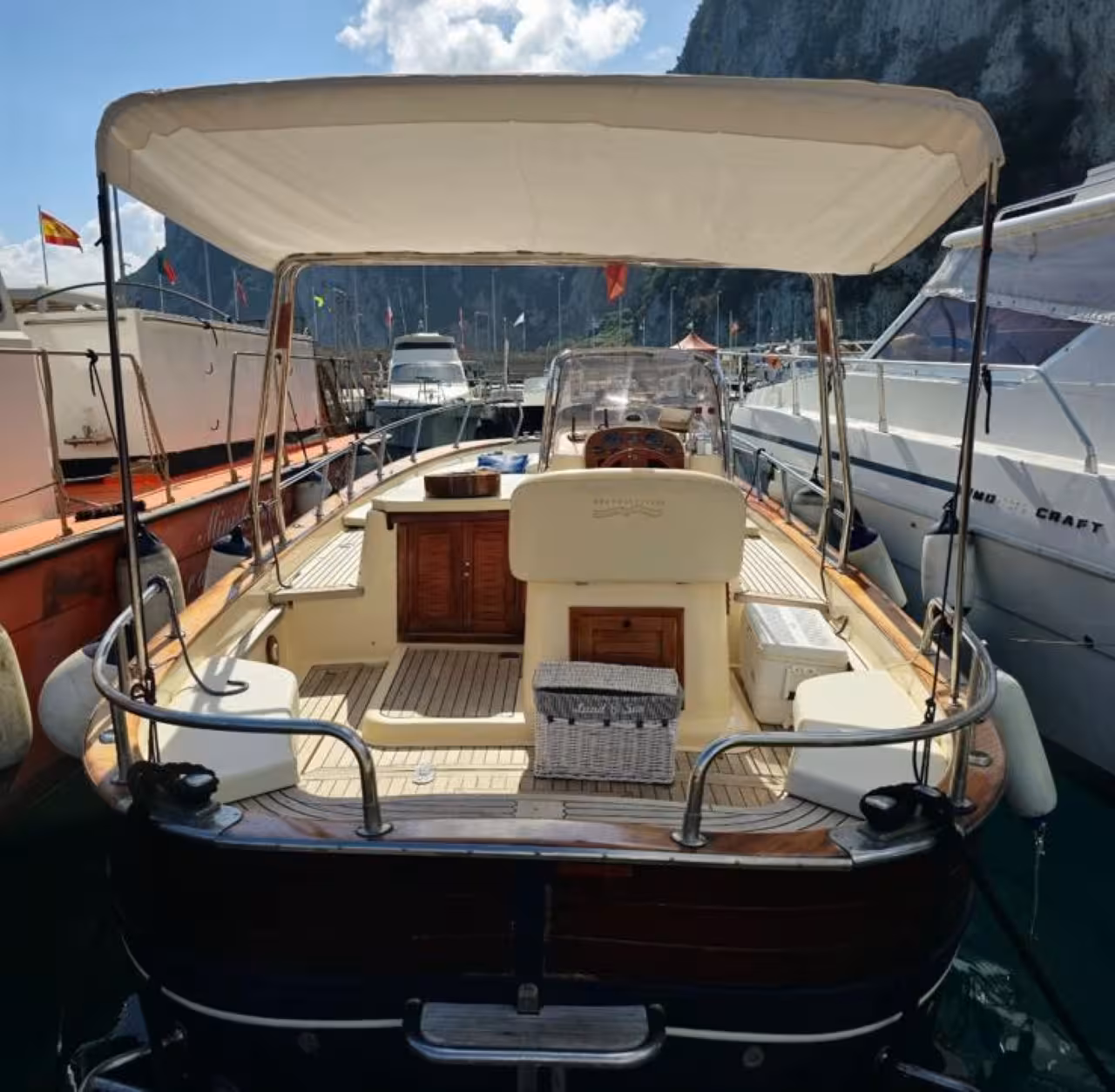 Private Capri tour boat cockpit with canopy, ready for a 6-hour cruise to swim and discover hidden coves