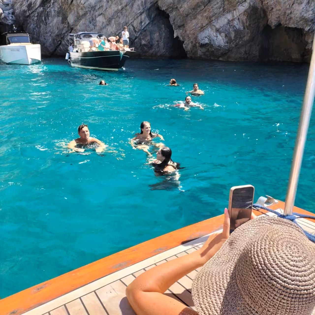 Snorkel stop in Capri’s turquoise bay near sea caves on a 6-hour private boat tour to hidden gems