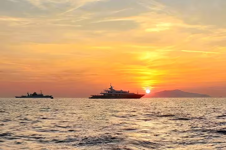 Sunset on the sea during a private full-day boat tour, yachts on calm waters for a charm and freedom cruise