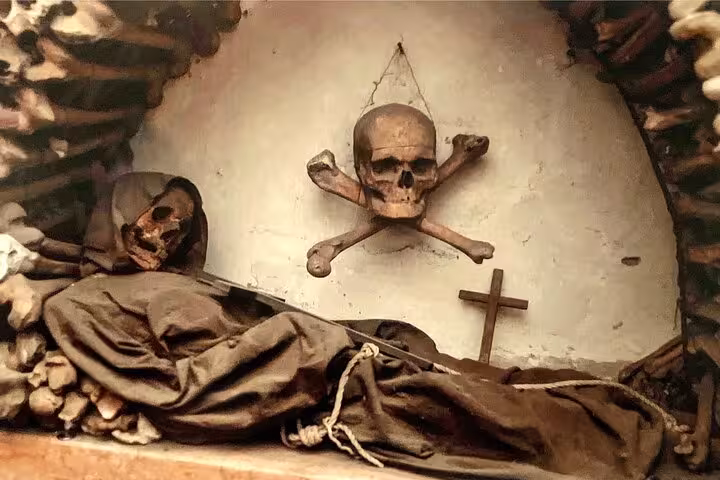 Eerie display of skulls and bones in Rome's Bone Crypts highlighting the city's mysterious history.