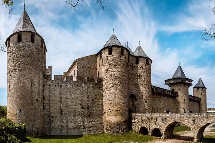 Entrance towers and stone bridge at Carcassonne fortress, perfect for a self-guided scavenger hunt tour