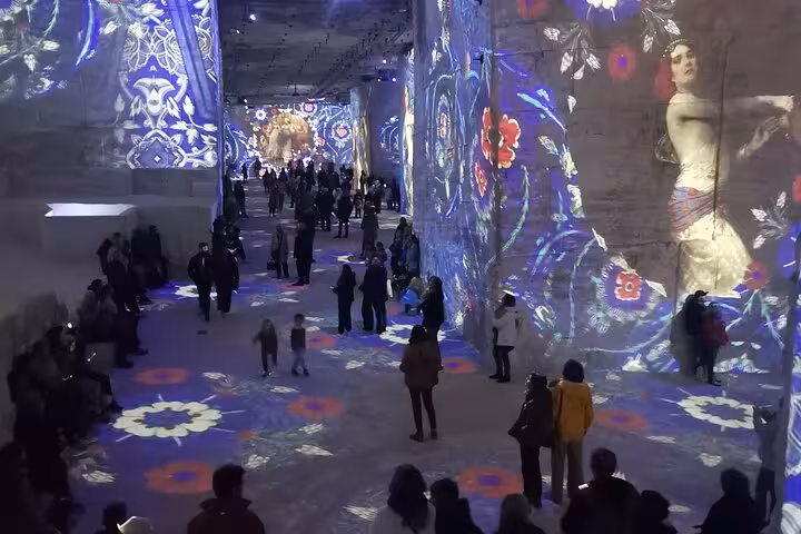 Immersive art show inside Carrières de Lumières, Les Baux-de-Provence highlight on Saint Rémy tour