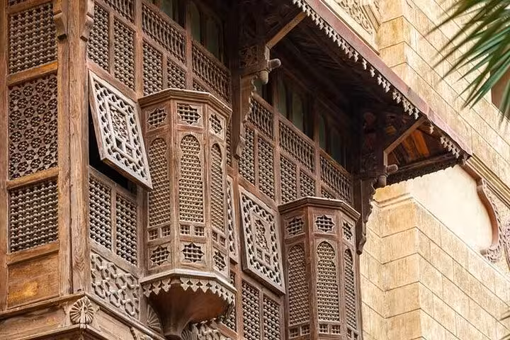 Carved mashrabiya wooden balcony in Historic Islamic Cairo, a highlight on the guided walking tour