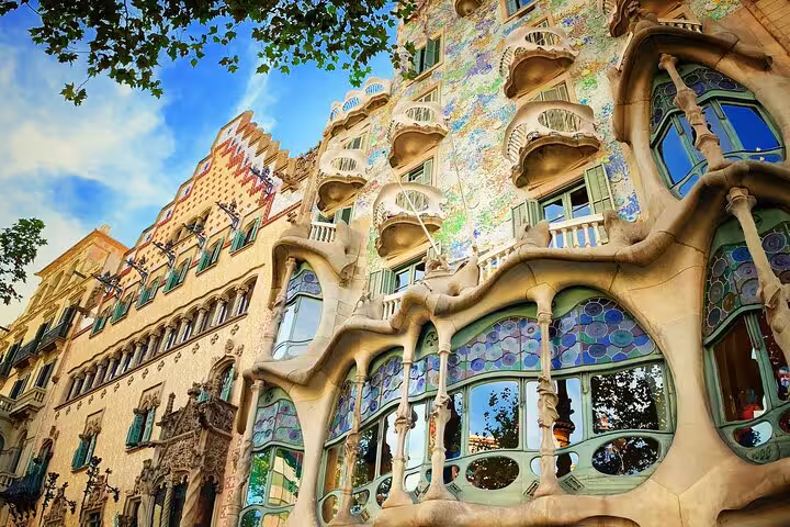 Vibrant facade of Gaudi's Casa Batlló in Barcelona's Eixample district, showcasing its unique architectural style.