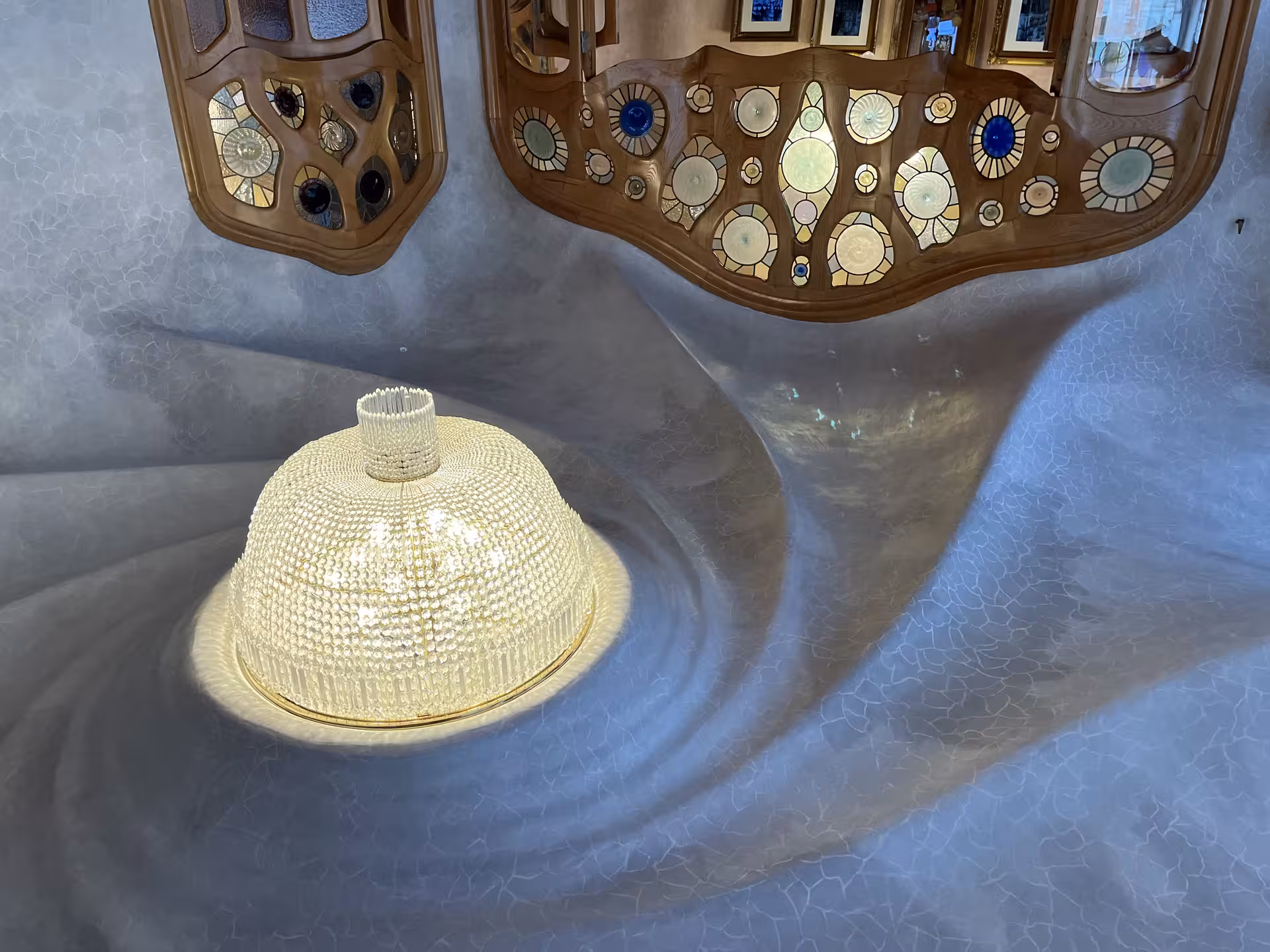 Casa Batlló interior lightwell with stained glass and Gaudí design, part of Casa Batlló and La Pedrera night experience