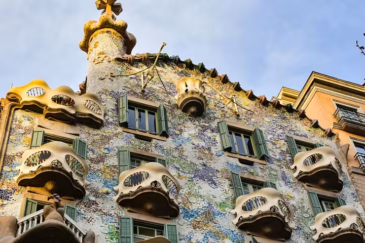 Colorful facade of Casa Batlló with unique architectural elements, highlighting Barcelona's artistic flair on the tour.