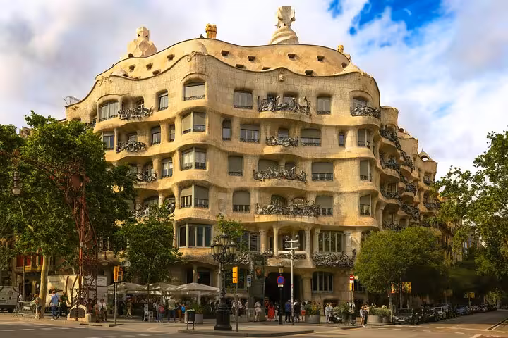Stunning view of Casa Milà, an iconic Gaudí-designed building in Barcelona, featured on a local transport city tour.