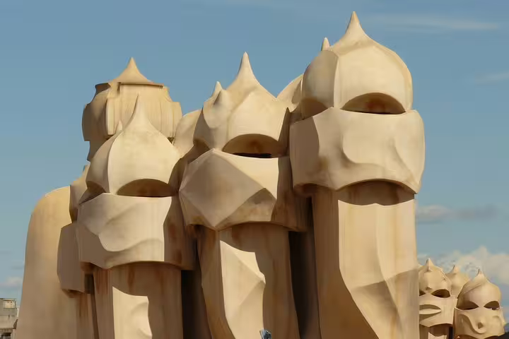 Close-up of Casa Milà's sculptural rooftop chimneys in Barcelona, showcasing Gaudí's unique architectural design.