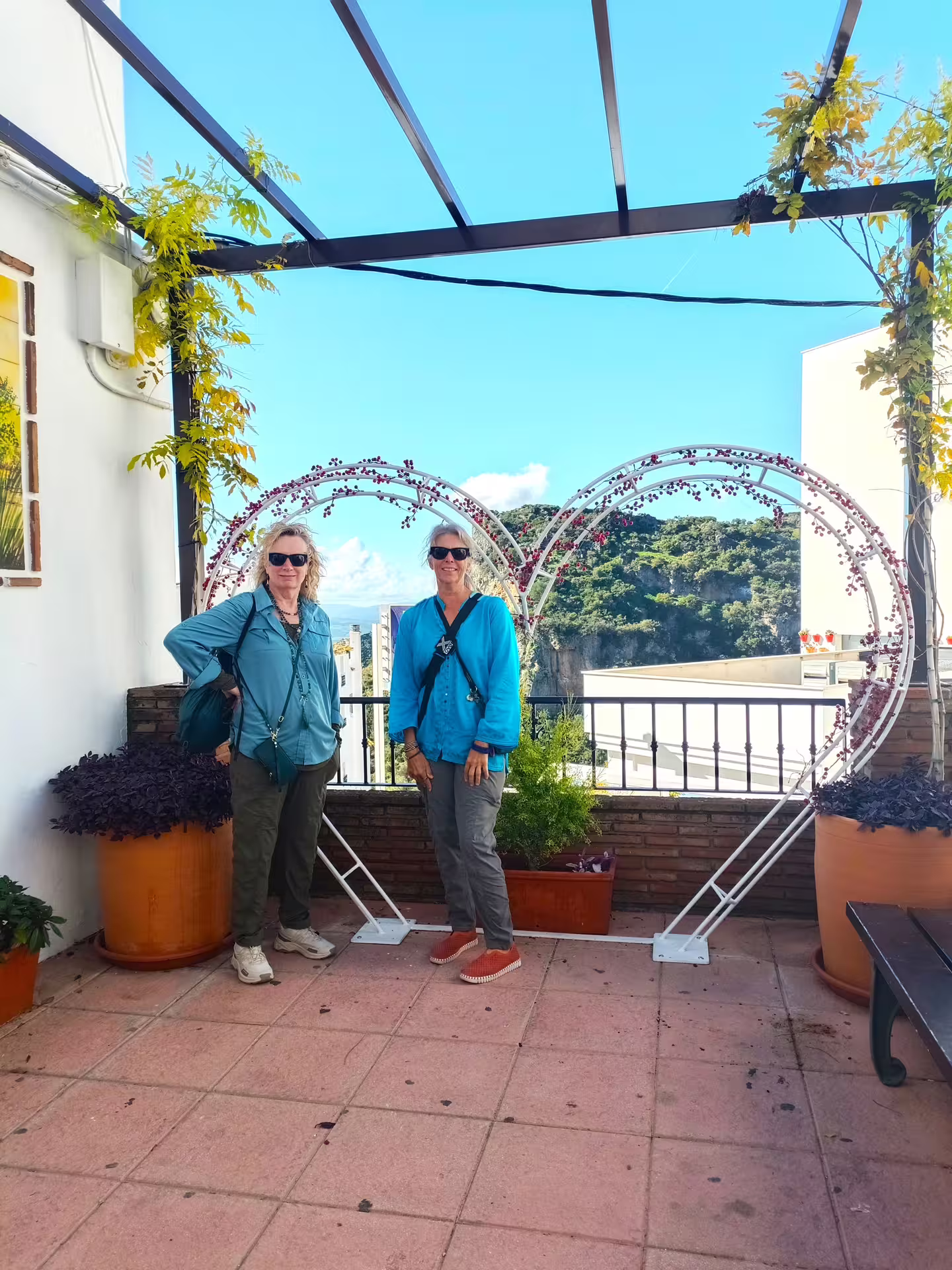 Travelers posing at a Casares viewpoint terrace on a private Casares and Estepona tour with hotel pick-up Costa del Sol