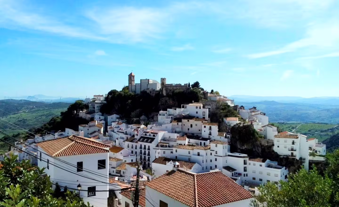 Panoramic view of Casares white village and hilltop castle, Andalusia, on a private tour from Costa del Sol