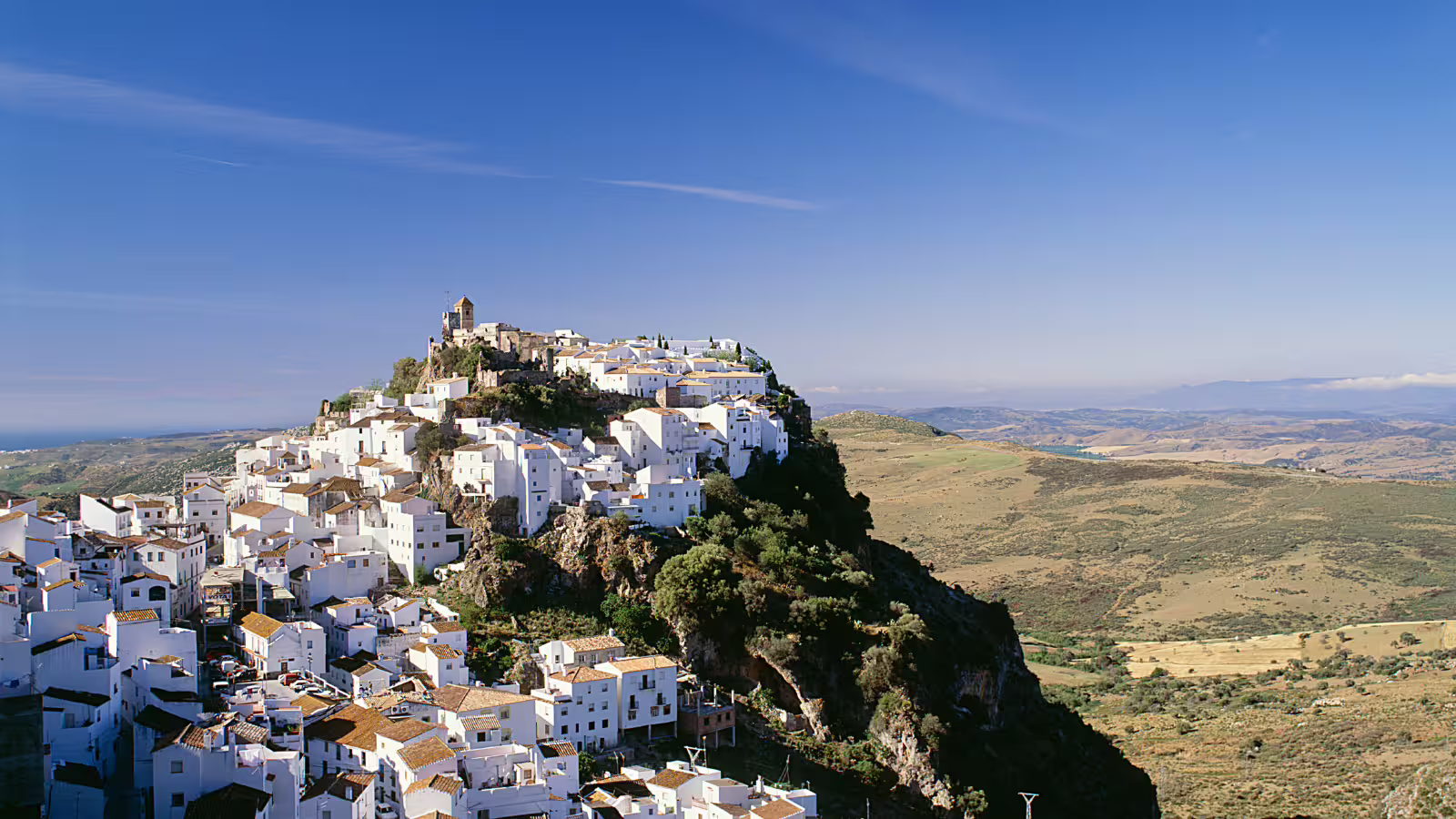 Panoramic view of Casares white village on a hilltop, highlight of the private Casares and Estepona tour