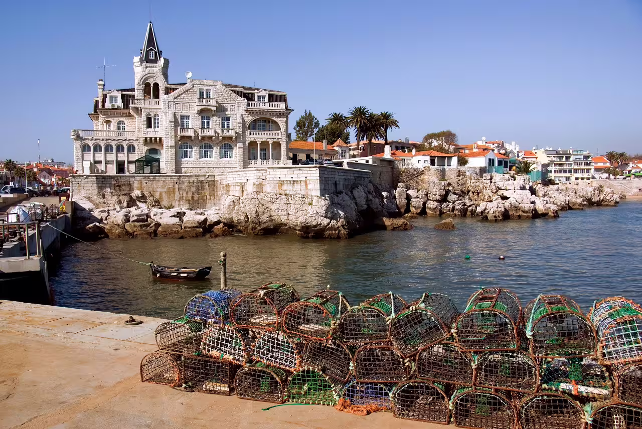 Historic coastal architecture and traditional fishing traps in picturesque Cascais, Portugal, showcasing local culture and charm.