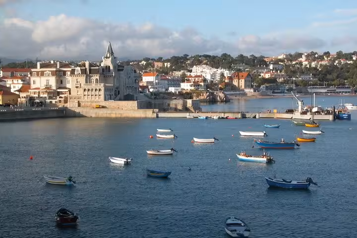 Picturesque view of boats in Cascais harbor, part of a small group tour to Sintra, Pena Palace, and Cabo Roca.