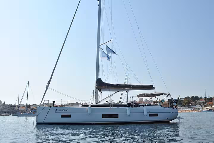 Modern sailboat anchored in Cascais bay for a private 2-hour romantic cruise with sparkling wine in Portugal