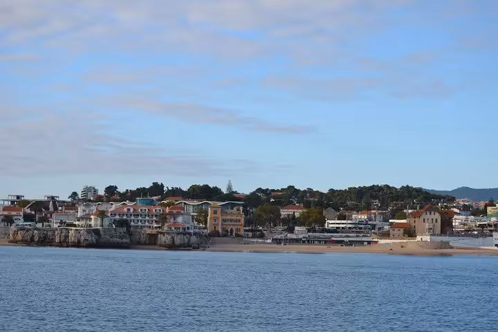 Cascais coastline and beach views from the Atlantic on a private sailing cruise, half-day or full-day tour