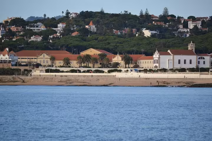 Cascais bay waterfront and historic buildings viewed from the sea on a private sailing cruise in Portugal