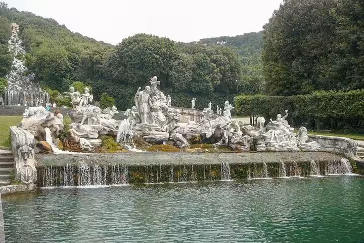 Dramatic baroque fountain and mythological statues in the royal gardens of Caserta Palace visited on a private guided tour