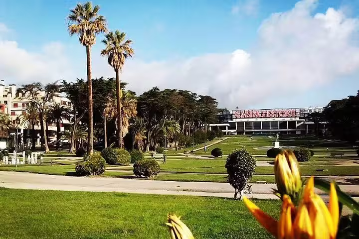 Lush gardens and iconic Casino Estoril under a blue sky, captured on the Sintra Cabo da Roca Cascais Estoril tour.