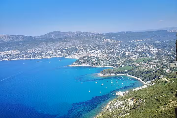 Turquoise bay and boats near Cassis Calanques seen from above on full-day Aix-en-Provence and Marseille tour