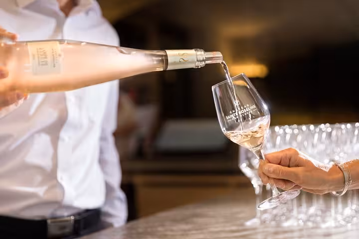Elegant wine pouring at a Cassis tasting room, showcasing premium regional wines on a private tour.