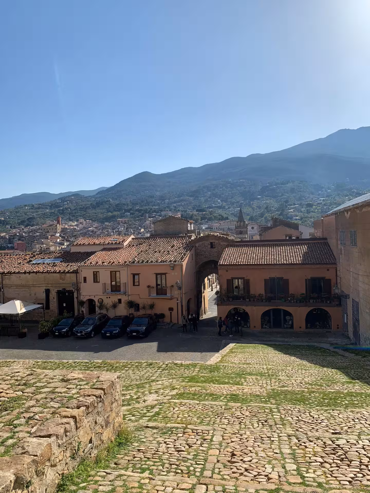 Panoramic view over Castelbuono’s terracotta rooftops and green Madonie mountains on a private Palermo day trip
