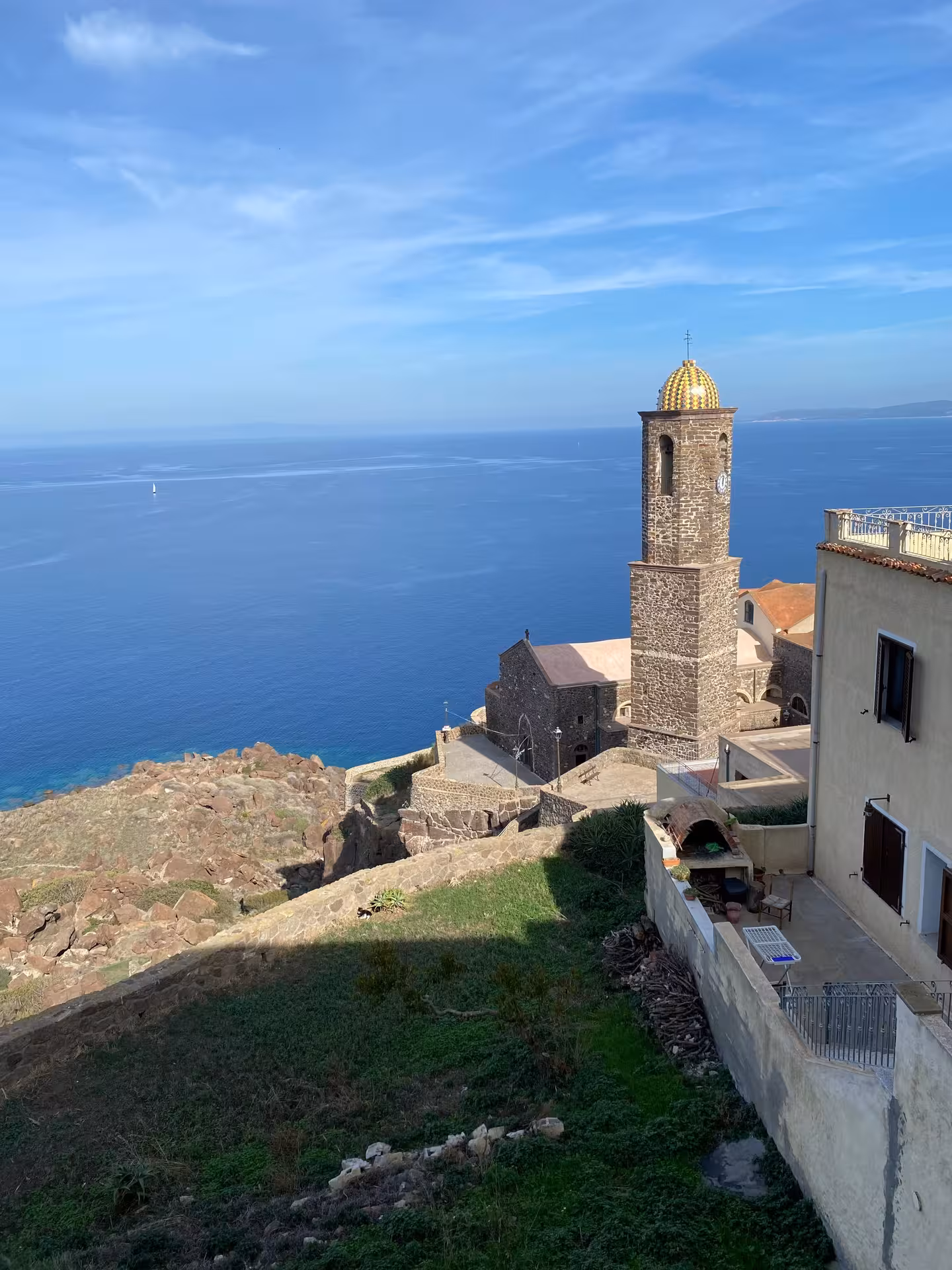 Historic tower overlooking the sea in Castelsardo, highlighting its rich cultural heritage.