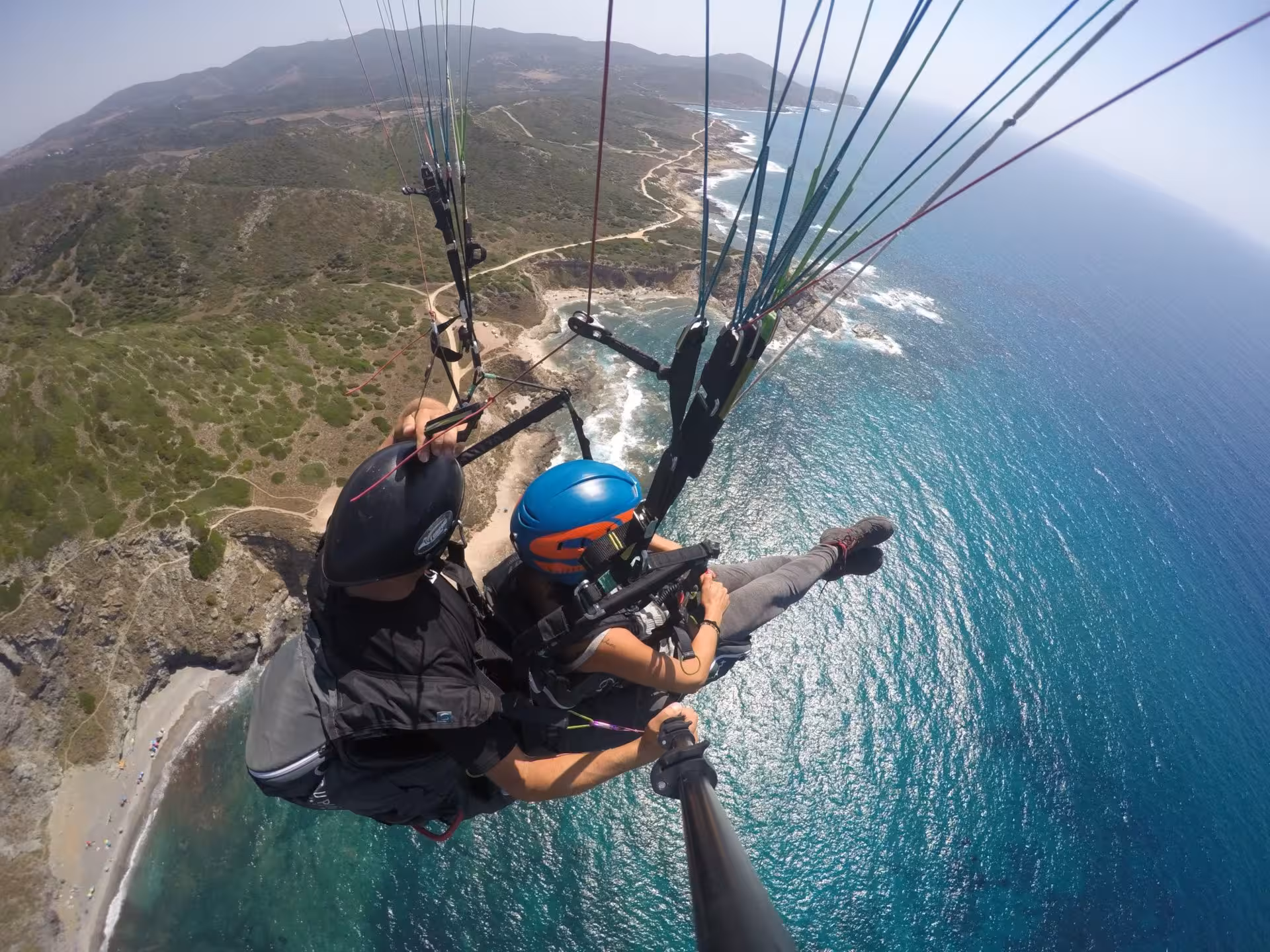 Enjoy breathtaking views of Littigheddu's coastline during a tandem paragliding flight over Castelsardo.