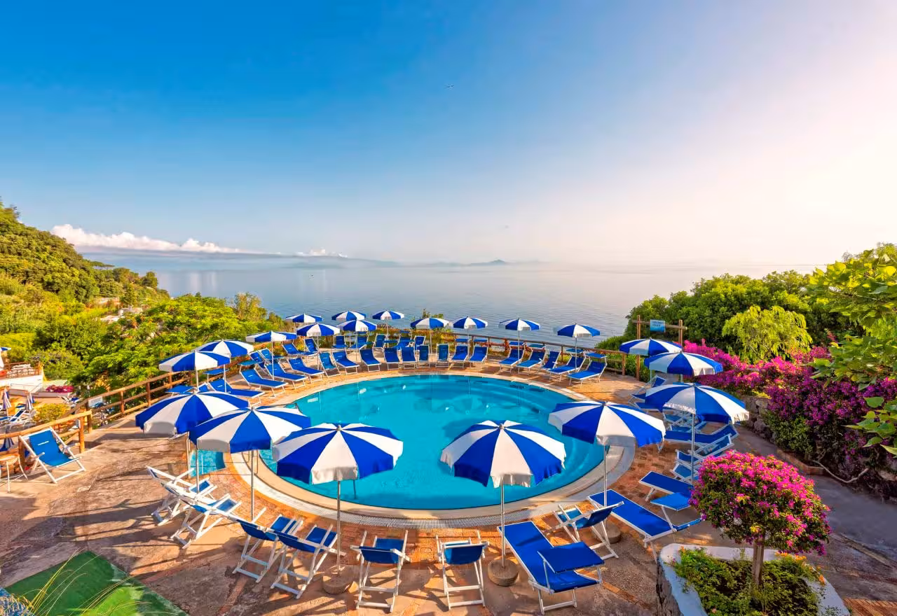 Circular thermal pool with sun loungers at Castiglione Thermal Baths, Ischia day trip with Naples transfer
