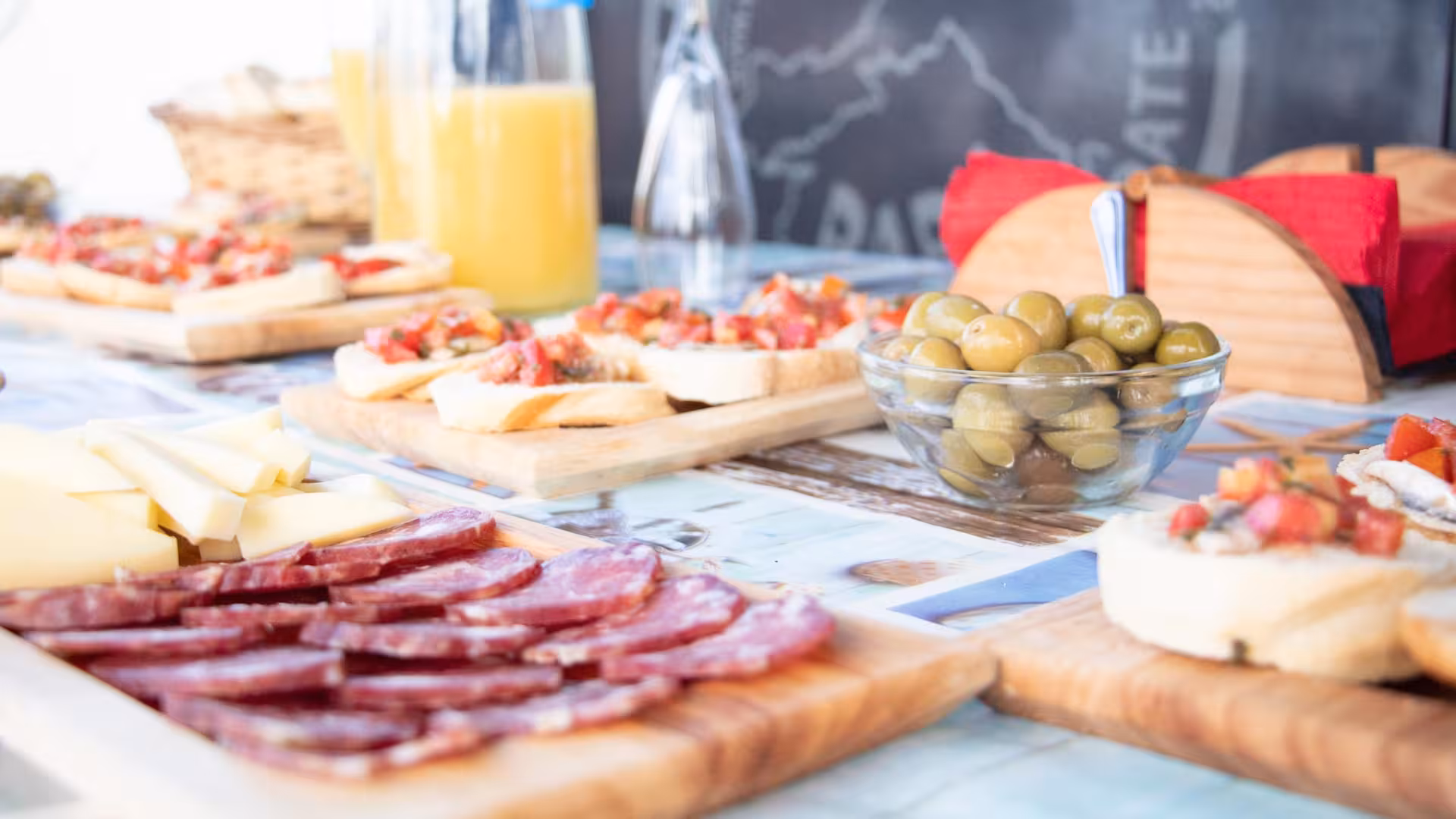 Savor local delicacies like bruschetta, cheese, and olives on a catamaran tour to Asinara Island from Stintino.