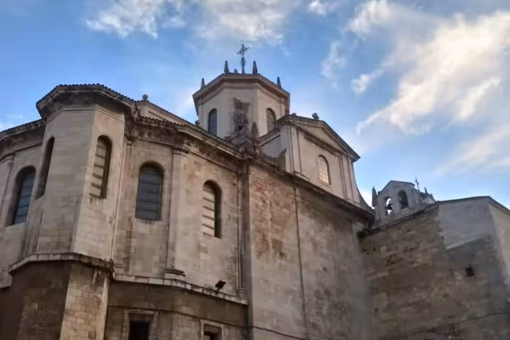 Majestic exterior of Cathedral of Santander against a blue sky, ideal for a guided historical tour.