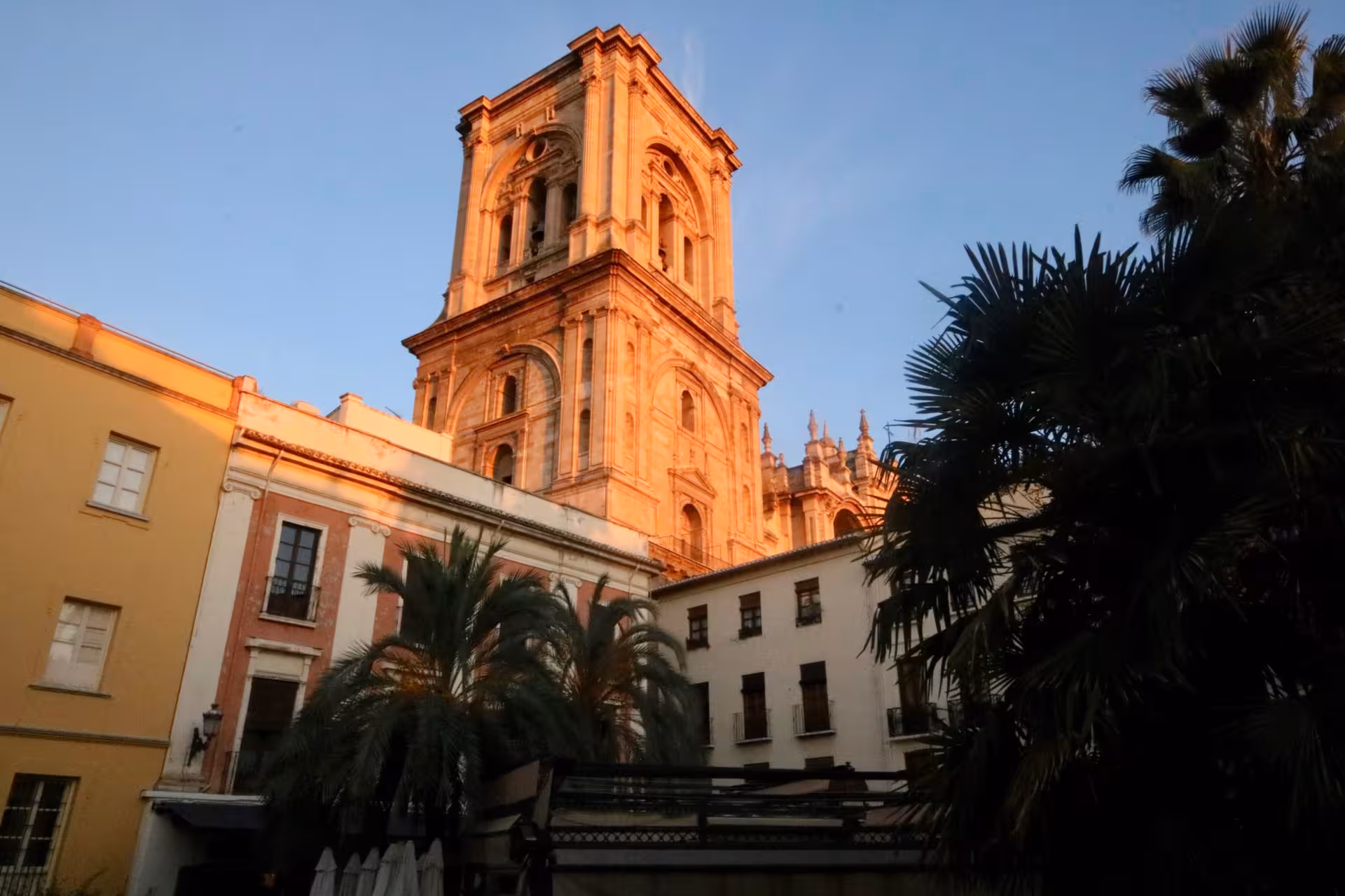 View of the cathedral tower at sunset, highlighting its historic architecture on a guided tour with admission included.