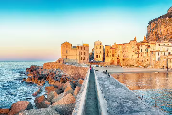 Cefalu seafront promenade and medieval old town at sunset on private half-day trip from Palermo