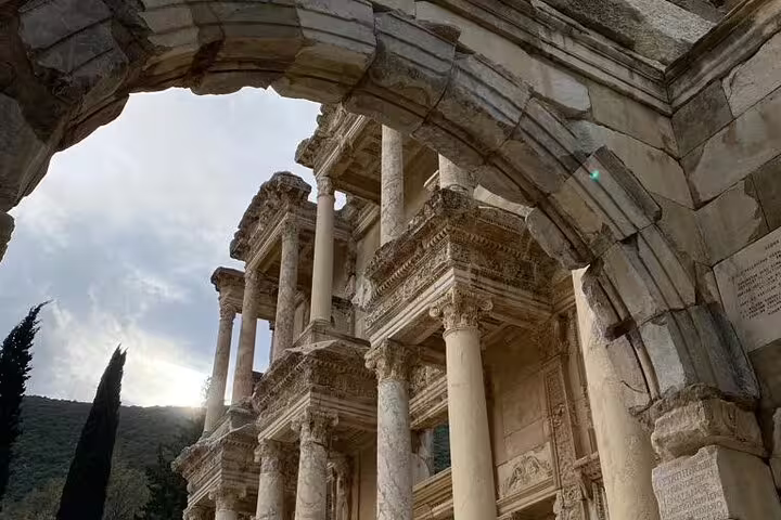 Celsus Library facade framed by arch in Ancient Ephesus on private tour with St John Basilica and lunch