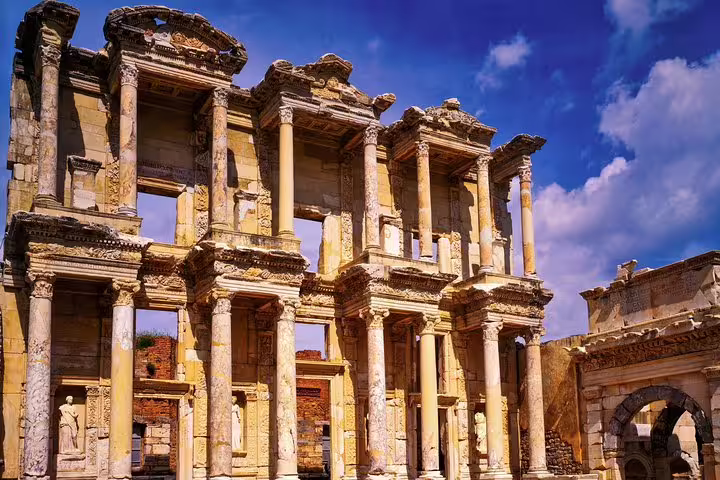 Marvel at the grandeur of the Celsus Library under a vibrant sky on a skip-the-line Ephesus tour from Izmir.