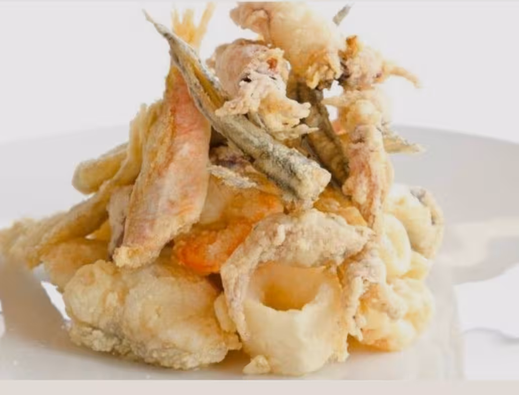 Plate of fried seafood on Cesenatico Adriatic Coast tour, local Romagna fish tasting after cruise