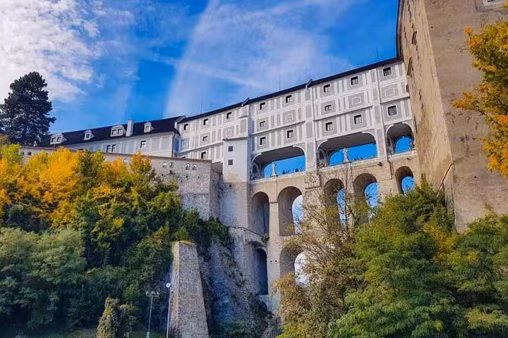Cesky Krumlov Castle bridge and arches in autumn, scenic stop on Salzburg to Vienna private transfer