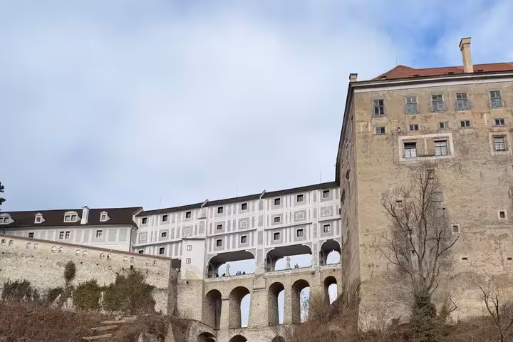 Cesky Krumlov Castle arches and bridge, highlight stop on Vienna to Prague private transfer tour
