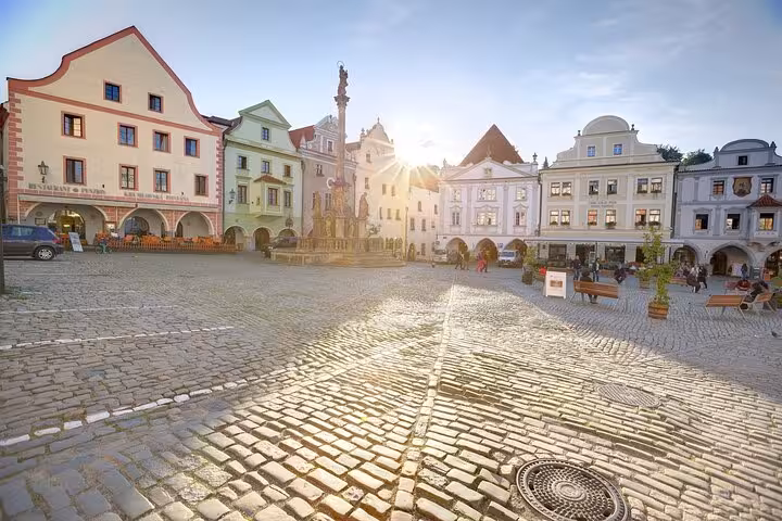 Sunlit cobblestone main square in Cesky Krumlov, a highlight of the small-group day tour from Vienna