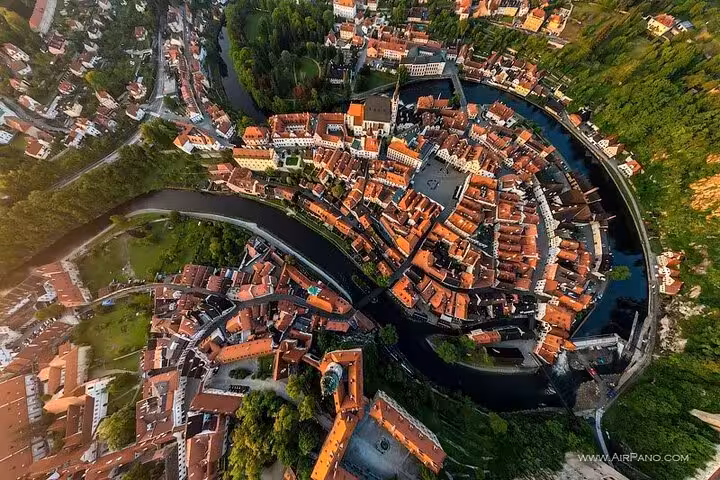 Aerial view of Cesky Krumlov old town looped by Vltava river, Prague to Vienna private transfer stop