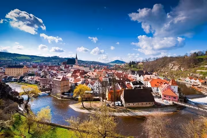 Sunny Vltava River bend and Cesky Krumlov skyline, scenic small-group day trip from Vienna to Czechia