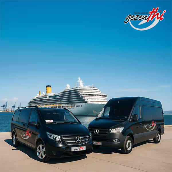 Two black Mercedes-Benz vans with Gezenthi Travel branding parked on a dock, with a cruise ship in the background under a clear blue sky.