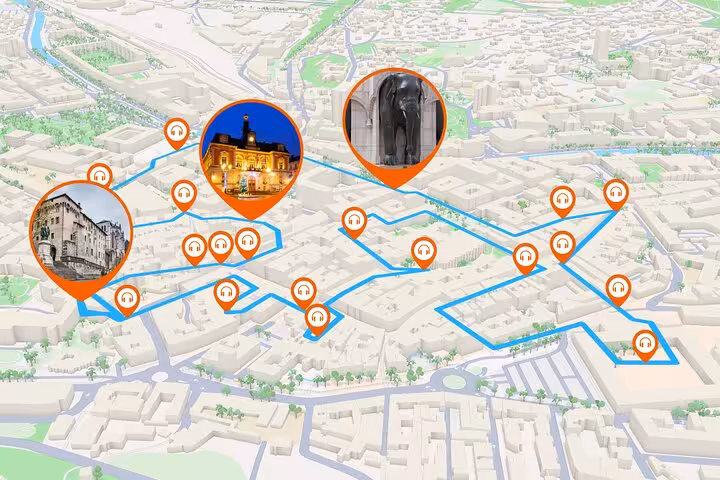 3D map of Chambery walking tour route with orange audio guide pins marking historic landmarks including elephant fountain