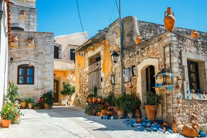 Traditional stone houses and pottery-lined lane in an Apokoronas village on the Chania 7 villages tour